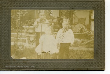 Description on back of photo reads: Arthur Farley (Phoebe's son), Frank, and Baby Mary.