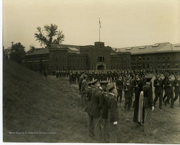 Back of photo reads: "R.O.T.C. Cadets Parade for President Chauncey Samuel Boucher and Lieutenant Colonel Leland Swarts Devore at West Virginia University, Morgantown, W. Va."