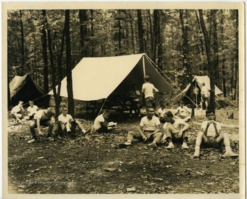 The Morgantown Boy Scouts setting up camp in the woods.