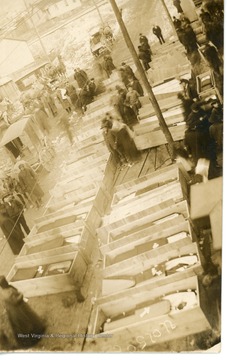 Mourners view rows of caskets from the mine disaster.