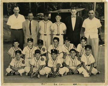 A photo of the 1954 Kiwanis Little League Championship baseball team with Coach Clyde Shelby (far right).