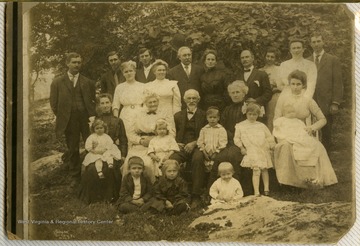 Standing, left to right: Walter Matheny (sp?), John Jenkins, Molly, Geo Jenkins, Electra Lecky (Ocie's daughter), Scott Gibson.Seated, left to right: Laura with Thelma, Pearl Conner Alcinda with Burhl, Ocie Matheny (Alcinda's daughter) "Mac" Forman, Abigail, Ruby, Mamie with Harold.Children seated on ground. 